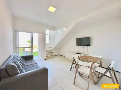 Uma televisão e/ou sistema de entretenimento em Beach Townhouses V