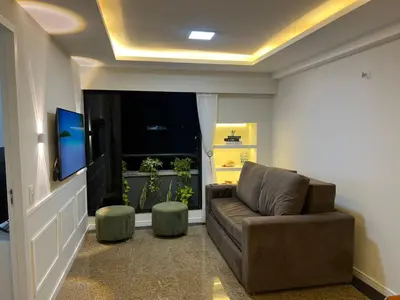Uma área de estar em Flat av beira mar lindo e aconchegante
