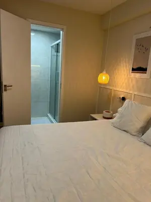 Uma cama ou camas num quarto em Flat av beira mar lindo e aconchegante