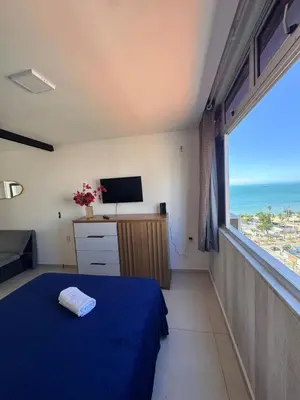 Uma cama ou camas num quarto em FLAT com vistar localizaçao TOP