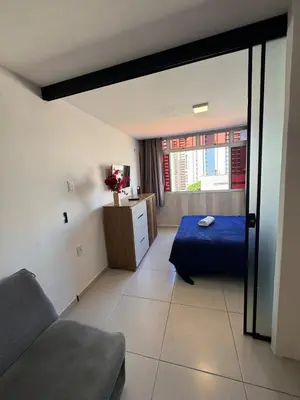 Uma cama ou camas num quarto em FLAT com vistar localizaçao TOP