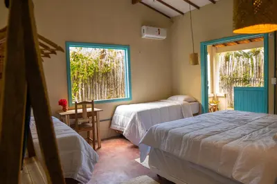 Uma cama ou camas num quarto em Casa Cajuzal Carrapateira