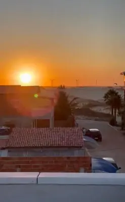 O nascer ou o pôr do sol visto a partir da casa de férias