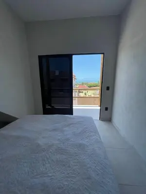 Uma cama ou camas num quarto em Taiba House