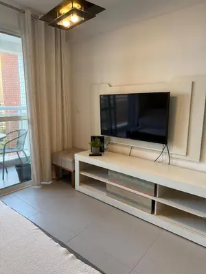 Uma televisão e/ou sistema de entretenimento em Fortaleza Apartment