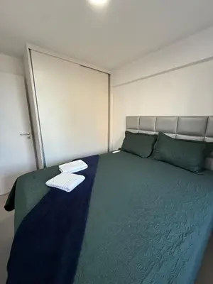 Uma cama ou camas num quarto em Fortaleza Apartment