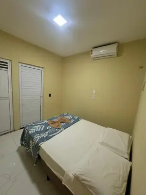 Uma cama ou camas num quarto em Apartamento refúgio