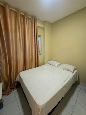 Uma cama ou camas num quarto em Apartamento refúgio