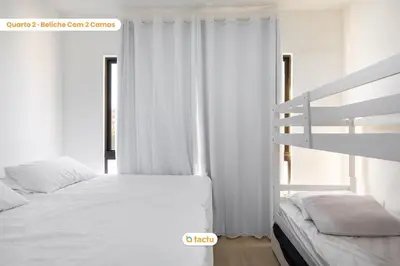Uma cama ou camas num quarto em Duplex luxo em condomínio ao lado da praia