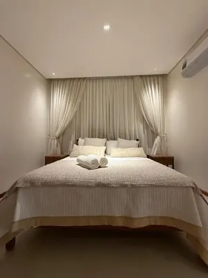 Uma cama ou camas num quarto em Sítio João de Barro