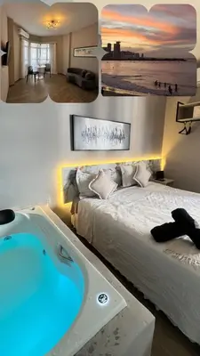 Uma cama ou camas num quarto em 1155 golden 55m2 1 quarto frente mar avenida beira mar