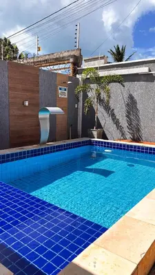 A piscina em ou perto de CASA COM 04 QUARTOS 04 BANHEIROS PRAIA do PREÁ
