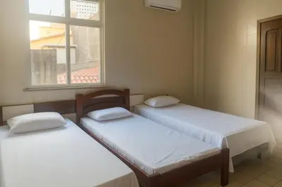 Uma cama ou camas num quarto em Hotel Lídia