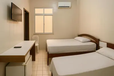 Uma cama ou camas num quarto em Hotel Lídia