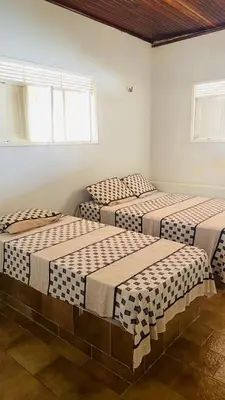 Uma cama ou camas num quarto em Maravilhosa casa com piscina