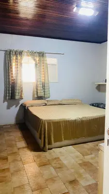 Uma cama ou camas num quarto em Maravilhosa casa com piscina