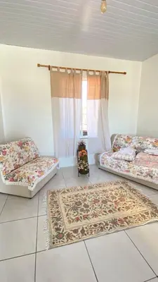 Uma cama ou camas num quarto em Casa Frente Mar na Cidade Luz