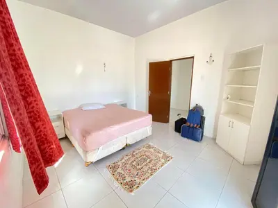 Uma cama ou camas num quarto em Casa Frente Mar na Cidade Luz