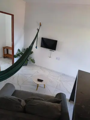 Uma televisão e/ou sistema de entretenimento em Pousada Apart Praia Uruaú