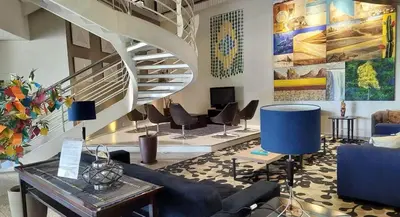 Uma área de estar em Flat Beira Mar para até 4 pessoas