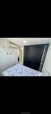 Uma cama ou camas num quarto em Apartamento por temporada Edifício Amazonas