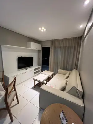 Uma televisão e/ou sistema de entretenimento em Apto Beverly Hills Residence, próx Beach Park
