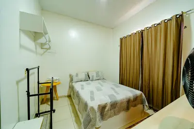Uma cama ou camas num quarto em Flat Completo p 2 pessoas Proximo ao Aeroporto