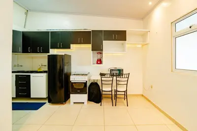 A cozinha ou kitchenette de Flat Completo p 2 pessoas Proximo ao Aeroporto