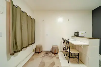 Uma televisão e/ou sistema de entretenimento em Flat Pet Friendly prox ao Aeroporto