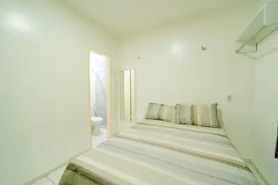 Uma cama ou camas num quarto em Flat Pet Friendly prox ao Aeroporto