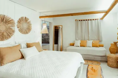 Uma cama ou camas num quarto em Kalit Hotel