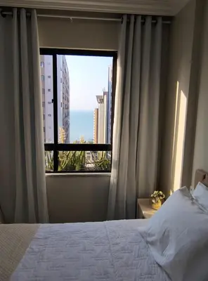 Uma cama ou camas num quarto em Flat Mar Premium 1408