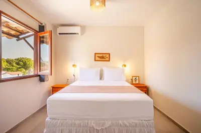 Uma cama ou camas num quarto em Vila Dádiva Jeri
