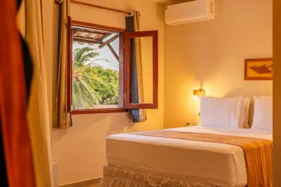 Uma cama ou camas num quarto em Vila Dádiva Jeri