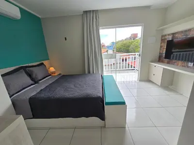 Uma cama ou camas num quarto em Residencial New Stilo-Falésia