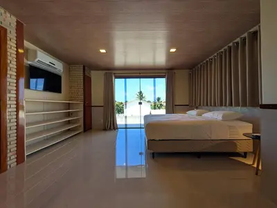 Uma cama ou camas num quarto em Parawing Paracuru