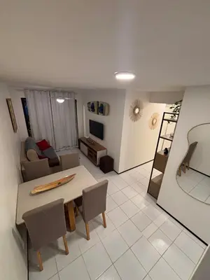 Uma televisão e/ou sistema de entretenimento em Appartement 11 à 200 de la plage