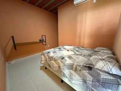 Uma cama ou camas num quarto em Recanto do Aconchego