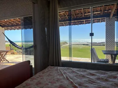 Uma cama ou camas num quarto em Casa Pé na Areia - Com PISCINA, CHURRASQUEIRA E VISTA PRIVILEGIADA - Beberibe