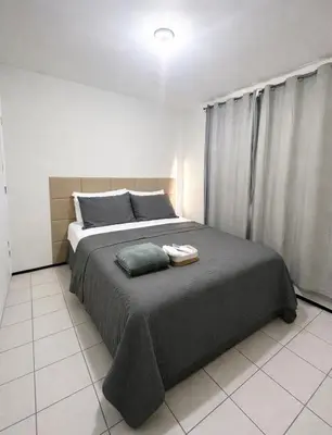 Uma cama ou camas num quarto em Apartamento Econômico e Aconchegante de 2 quartos