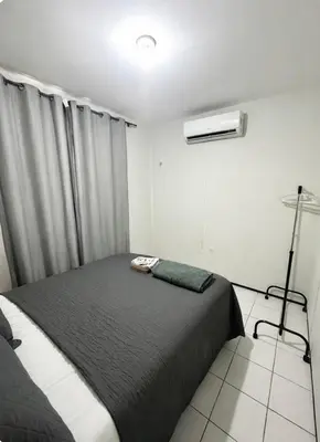 Uma cama ou camas num quarto em Apartamento Econômico e Aconchegante de 2 quartos