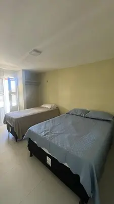 Uma cama ou camas num quarto em Casa Beach park