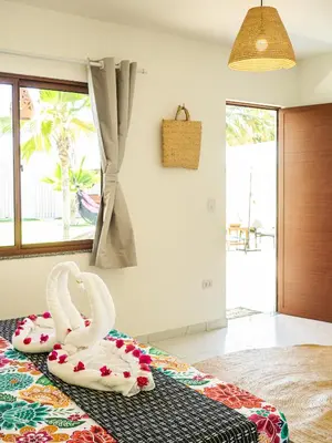 Uma cama ou camas num quarto em Kite Oasis Parajuru Casa Ilha