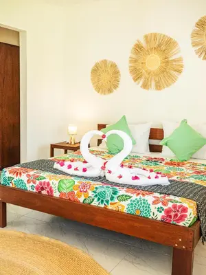 Uma cama ou camas num quarto em Kite Oasis Parajuru Casa Ilha