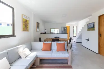 Uma área de estar em Beachfront Duplex #A3 - Beira mar por Carpediem