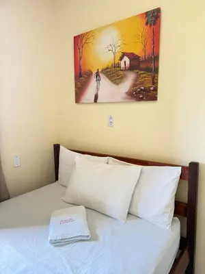 Uma cama ou camas num quarto em Pousada ExtraLar