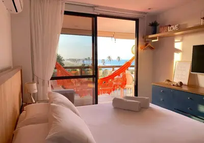 Uma cama ou camas num quarto em Seu Refúgio Pé na Areia