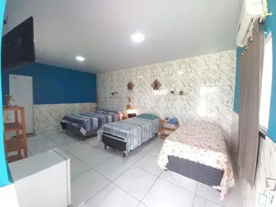 Uma cama ou camas num quarto em Pousada Sítio Boas Novas