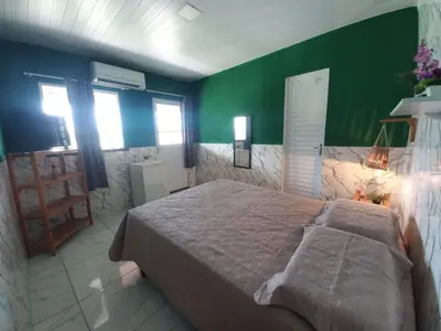 Uma cama ou camas num quarto em Pousada Sítio Boas Novas