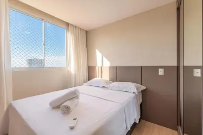 Uma cama ou camas num quarto em Mirante #905 - Fortaleza por Carpediem